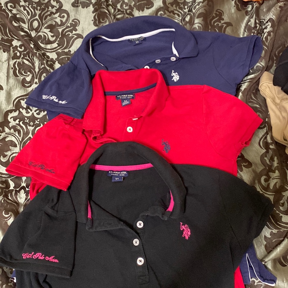 3 US Polo Assn polo shirts in red, black, and navy blue